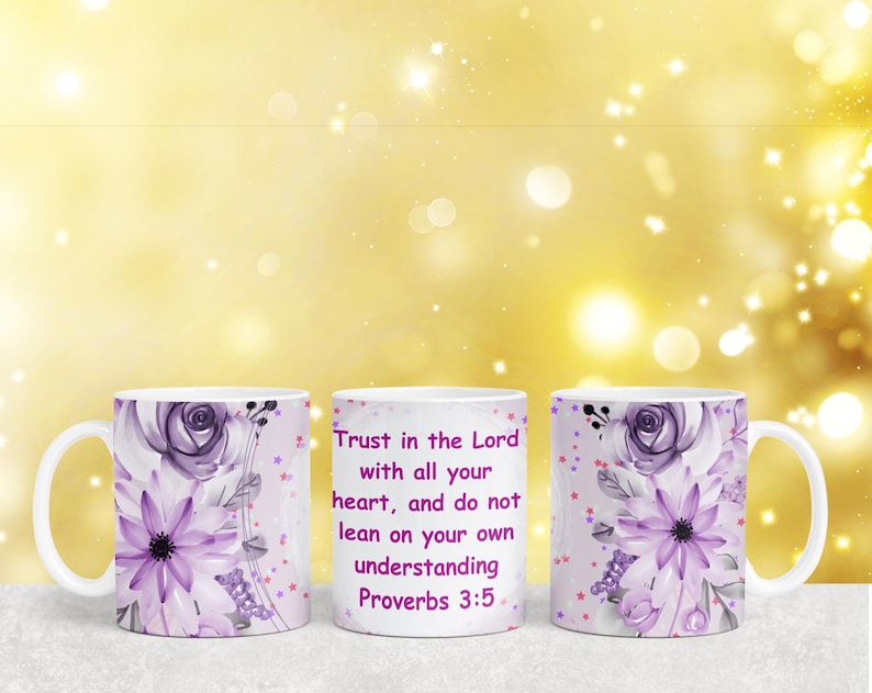 May include: Two white ceramic mugs with a purple floral design and gold glitter accents. The mug on the right has the text "Trust in the Lord with all your heart, and do not lean on your own understanding Proverbs 3:5" printed on it.