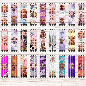 May include: A set of 30 colourful pens with various designs featuring a Highland cow. The pens have different sayings on them, including "Live Your Dream", "Make It Happen", "Good Vibes", "Just Do It", "Trust Process", "Peace & Petrichor", "Just Strong", "This Place", "Live Laugh Love", "Let's Go", "First Day", "You Got This", "Make Magic", "Crazy Strong", "Just Breathe", "Trust Process", "Peace & Petrichor", "Just Strong", "This Place", "Live Laugh Love", "Let's Go", "First Day", "You Got This", "Make Magic", "Crazy Strong", "Just Breathe", "Trust Process", "Peace & Petrichor", "Just Strong", "This Place".