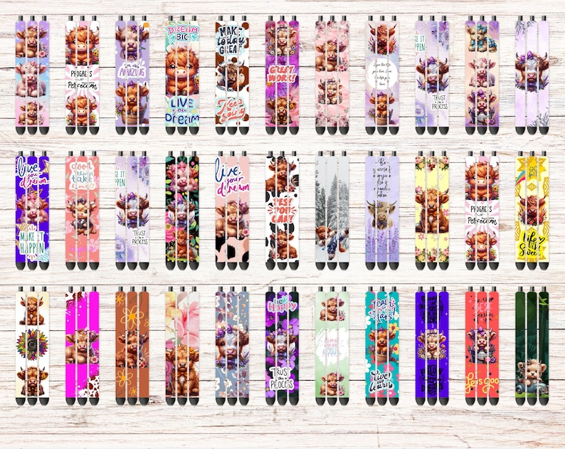 May include: A set of 30 colourful pens with various designs featuring a Highland cow. The pens have different sayings on them, including "Live Your Dream", "Make It Happen", "Good Vibes", "Just Do It", "Trust Process", "Peace & Petrichor", "Just Strong", "This Place", "Live Laugh Love", "Let's Go", "First Day", "You Got This", "Make Magic", "Crazy Strong", "Just Breathe", "Trust Process", "Peace & Petrichor", "Just Strong", "This Place", "Live Laugh Love", "Let's Go", "First Day", "You Got This", "Make Magic", "Crazy Strong", "Just Breathe", "Trust Process", "Peace & Petrichor", "Just Strong", "This Place".