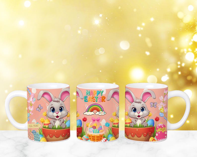 May include: Three white ceramic mugs with a pink background and a cartoon bunny rabbit holding Easter eggs. The mugs have the text "Happy Easter" on the front.