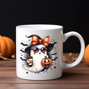 May include: White ceramic Halloween mug featuring a cartoon ghost wearing a witch hat with an orange bow, sunglasses, and holding a coffee cup and a jack-o'-lantern. The design includes bats and stars. The mug has a curved handle.