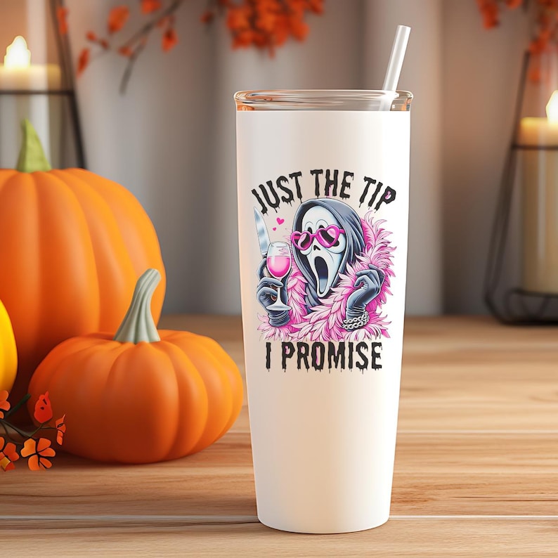 May include: White tumbler with a humorous graphic featuring a Scream mask wearing pink heart-shaped sunglasses and a pink boa, holding a knife and a glass of wine. The text reads "JUST THE TIP I PROMISE".