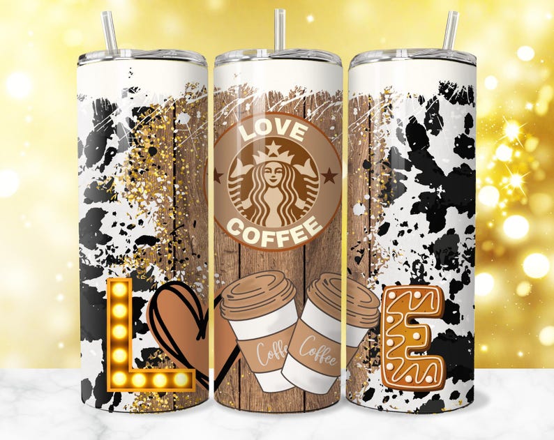 May include: Three stainless steel tumblers with a cow print design. The center tumbler features a brown wooden background with the text "Love Coffee" and a coffee cup graphic. The left tumbler has a light brown heart and a light up letter "L". The right tumbler has a gingerbread cookie letter "E".