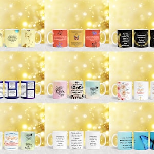 May include: A collection of 12 white ceramic mugs with various Christian-themed designs and scripture verses. The mugs feature colorful floral patterns, butterflies, and inspirational quotes.