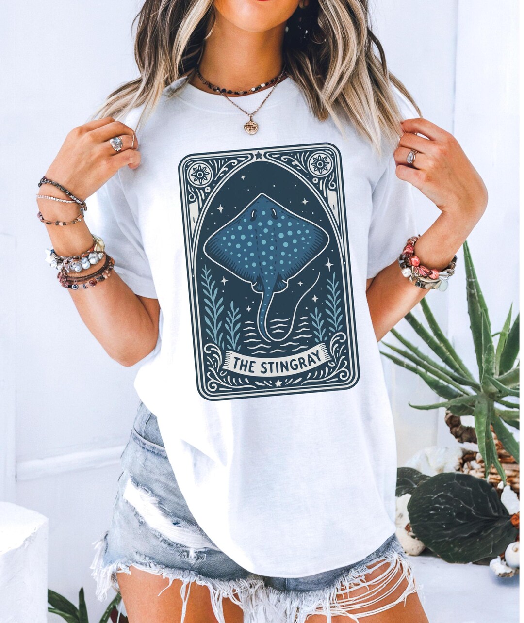 A t-shirt design featuring a Stingray Tarot card shirt, blending tarot symbolism with a playful stingray motif.