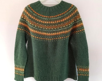 Hand knitted green nordic wool sweater with a yellow-orange patterned yoke
