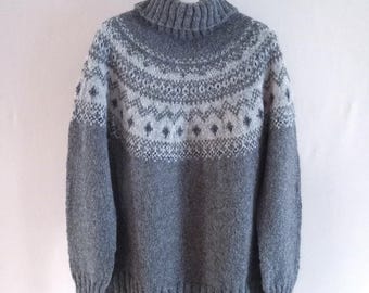 Hand knitted grey nordic wool sweater with a white patterned yoke