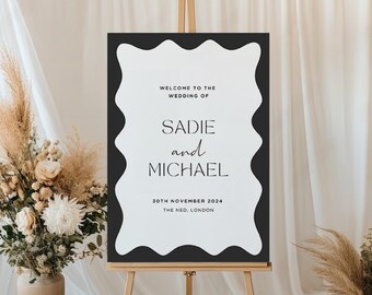 May include: A black and white wedding welcome sign with a wavy border. The sign reads "Welcome to the wedding of Sadie and Michael, 30th November 2024, The Ned, London."