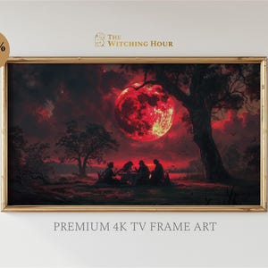 Puede incluir: Una impresión enmarcada de una luna roja oscura con un grupo de figuras reunidas alrededor de una mesa en un entorno boscoso. El texto "The Witching Hour" está en la esquina superior derecha de la imagen.