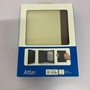 May include: A rectangular box with a blue and white design, showcasing a Kindle case. The case is black and has a handle. The box has the word "Atlas" printed on it, along with the "made for kindle" logo.