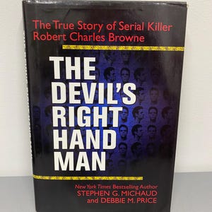 May include: A black hardcover book with the title "The Devil's Right Hand Man" and the subtitle "The True Story of Serial Killer Robert Charles Browne." The cover features white text and a blue background.