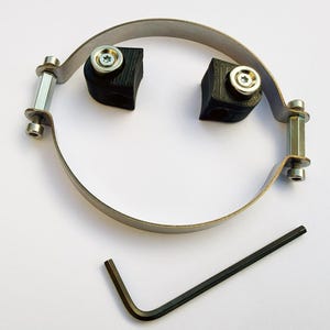 May include: A metal band with two black square blocks and silver hardware. The band is connected with bolts and nuts. A black Allen key is also included.