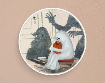 May include: A white ghost with a sad expression sits on a small stool, holding a small orange pumpkin. The ghost is in front of a door with a keyhole and a shadow of a monster with claws reaching out.