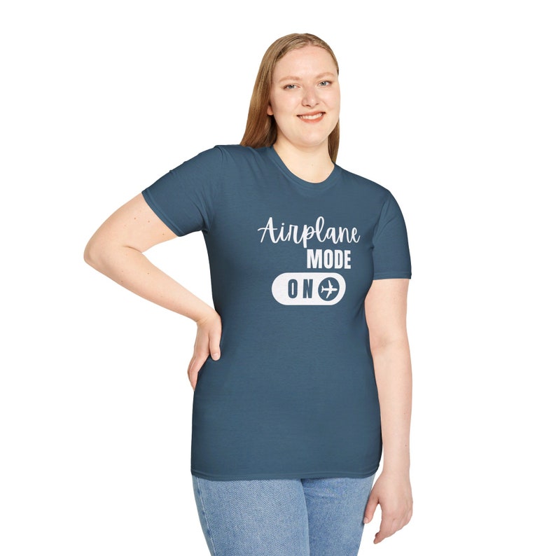 Indigo blue t-shirt with white Airplane Mode ON design featuring a sliding switch graphic and plane icon.