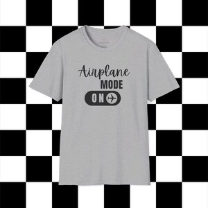 Gray t-shirt with black Airplane Mode ON design featuring a sliding switch graphic and plane icon.