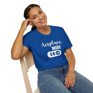 Royal blue t-shirt with white Airplane Mode ON design featuring a sliding switch graphic and plane icon.