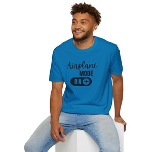 Sapphire blue t-shirt with black Airplane Mode ON design featuring a sliding switch graphic and plane icon.