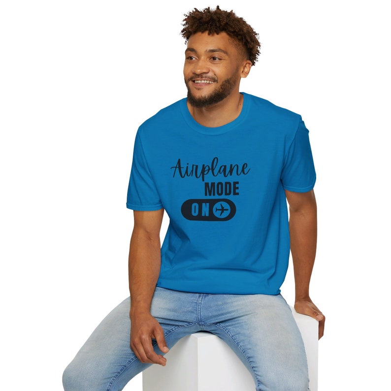 Sapphire blue t-shirt with black Airplane Mode ON design featuring a sliding switch graphic and plane icon.