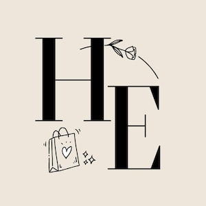 May include: Black and white graphic design with the letters "HE" in a bold serif font. A small shopping bag with a heart and sparkles is next to the letters. A floral element is above the "E".