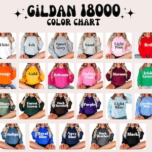Op de afbeelding: Een kleurenkaart voor Gildan 18000 sweatshirts. De kaart toont verschillende sweatshirtkleuren, waaronder wit, as, sportgrijs, zand, lichtroze, rood, oranje, goud, heliconia, veiligheidsroze, kastanjebruin en Iers groen.