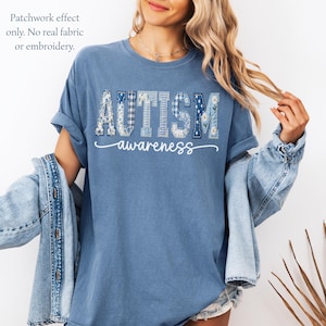 May include: Blue t-shirt with the word "AUTISM" in patchwork letters and the word "awareness" in a cursive font. The patchwork effect includes floral and gingham patterns. The text "Patchwork effect only. No real fabric or embroidery" is in the upper left corner.
