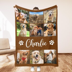 May include: A brown fleece blanket featuring a collage of photos of a Golden Retriever dog. The blanket has the name "Charlie" in white script, along with paw print designs. The photos show the dog in various poses.