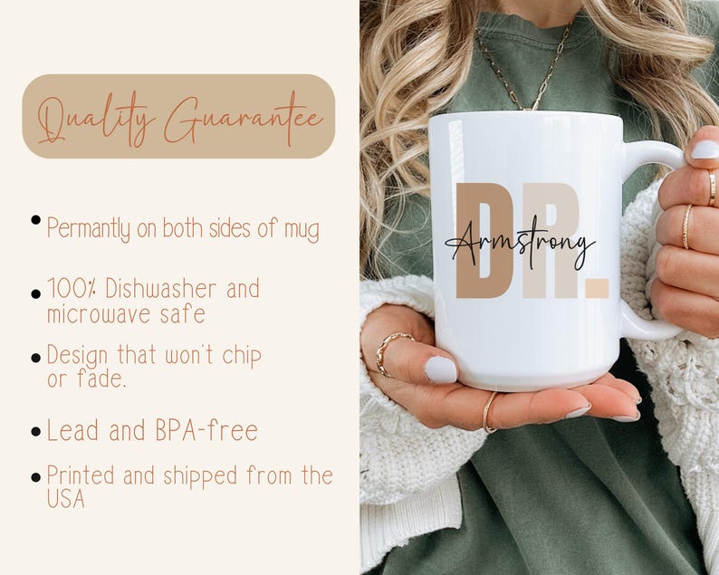 May include: White ceramic mug with the text "DR. Armstrong" in brown lettering. The mug is being held by a person's hand.
