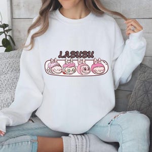 Sudadera Labubu con lindas cabezas, personajes de dibujos animados kawaii, jersey cómodo, jersey neutro en cuanto al género, top con estampado gráfico divertido