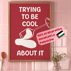 May include: A red poster with white text that reads "Trying to be cool about it". A white outline of a wine glass is shown spilling its contents. A pink sticker with white text reads "50% of all profits donated to Palestine" and features the Palestinian flag.