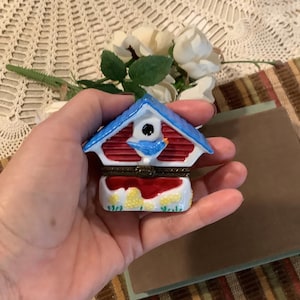 May include: A set of three ceramic mugs with a speckled, matte finish. The mugs are in shades of cream, light gray, and dark gray. Each mug has a simple, minimalist design, perfect for coffee or tea.