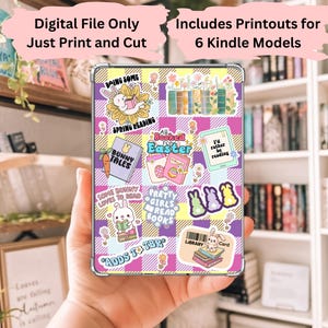 May include: A digital file of printable stickers for a Kindle e-reader. The stickers feature a pink and purple plaid background with various illustrations, including bunnies, books, and Easter-themed designs. The text on the stickers includes "Doing Some Spring Reading", "Bunny Tales", "Booked for Easter", "I'd rather be reading", "Some bunny loves to read", "Pretty girls read books", and "Adds to TBR".