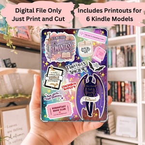 May include: A Kindle case with a colorful design featuring the text "It's Romantasy" and various stickers. The stickers include phrases like "Fairytales Spicier," "Enemies Lovers," and "Hot Girls Read Fantasy." The case is designed for 6 Kindle models.