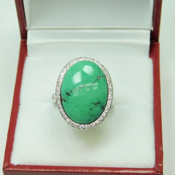 AAAA Turquoise from Royston Nevada  18x13mm  7.21 Carats   18K Yellow gold Diamond halo cabochon ring.  9 grams 4030