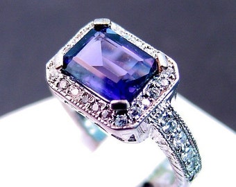 AAA Blue Iolite   9x7mm  1.95 Carats   in 14K gold and diamond ring .35 carats TW 0809 MMMM