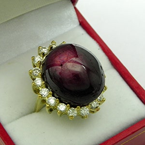 37 Ct Purple Red Star Ruby   20x16.3mm  37 Carats   in 18K yellow gold Diamond halo ring with 1.5 carats of Diamonds w/ Certificate 1349