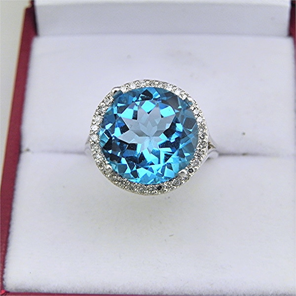 AAAA  Swiss Blue Topaz  12mm  7.21 carats   in 14K White gold Diamond Halo ring with  .15 carats of  VS diamonds 0838