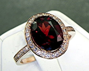 AAA Pyrope Red Garnet   10x8mm  3.07 Carats   in a 14K Rose gold ring with diamonds (.32ct) Ring 1137 DDD