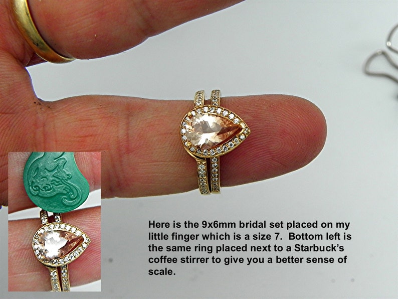 May include: A bridal set with a pear-shaped, light pink gemstone surrounded by smaller clear gemstones. The ring is on a finger and next to a coffee stirrer for size comparison.  The text "Here is the 9x6mm bridal set placed on my little finger which is a size 7. Bottom left is the same ring placed next to a Starbucks coffee stirrer to give you a better sense of scale." is visible below the ring.