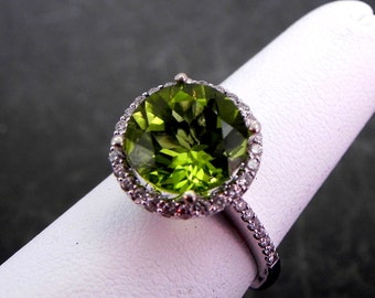 AAAA Peridot  10.2mm  3.80 Carats   Round in 14K white gold Halo ring with .40 carats of diamonds.  1375