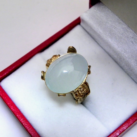 AAA Aquamarine Cabochon 8.52 carats 14x11mm set in an old Antique style Floral 14K yellow gold ring. 1171