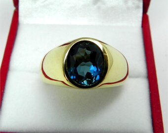 AAAA Blue London Blue Topaz   10x8mm  2.91 Carats   in  Heavy 14K Yellow gold MAN'S ring 18 grams. 2582