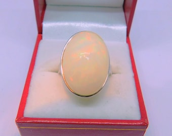 AAAA Ethiopian Opal   23x16mm  20.80 Carats   in 18K White Gold Ring 6-8 grams 14K available 4520
