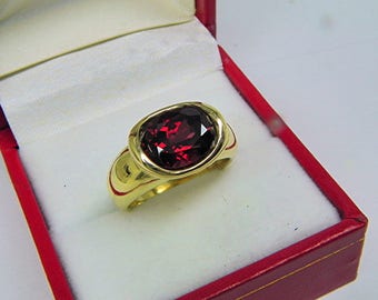 AAAA Rhodolite Garnet  3.45 carats  10x8mm in 14K Yellow gold bezel set ring.  0254