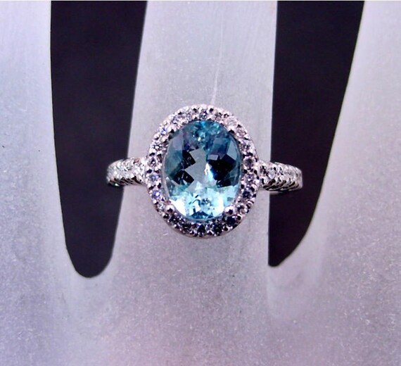 14K White Gold 10x8mm Oval Aquamarine & .06 CTW Diamond Halo Ring 14K White Gold 10x8mm Oval Aquamarine & .06 CTW Diamond Halo Ring