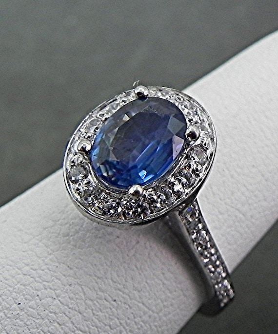 14K White Gold 10x8mm Oval Aquamarine & .06 CTW Diamond Halo Ring 14K White Gold 10x8mm Oval Aquamarine & .06 CTW Diamond Halo Ring