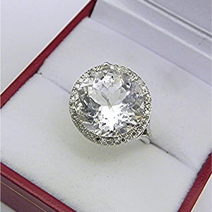AAAA  White Beryl Goshenite  12mm  5.29 carats   in 14K White gold Diamond Halo ring with  .15 carats of diamonds 0841