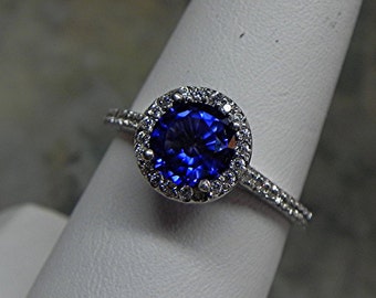 AAA Blue Sapphire   7.00 mm  1.41 Carats   Manmade 14K white gold Halo ring with .30 carats of diamonds MMM