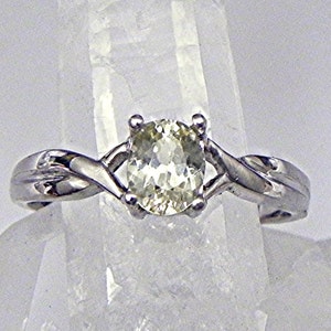 AAAA Natural Unheated Yellow Sapphire   6x5mm  .75 Carats   in a 14K white gold Infinity ring. 1991 MMMM