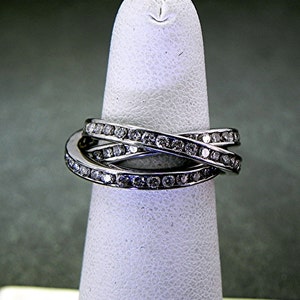 18K white gold Triple spinning ring with 2.0 Carats of Diamond channel set. w/ Certificate MMM