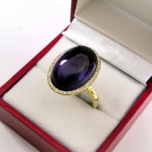 AAAA Amethyst 18x13mm  13.10 Carats   14K Yellow gold Diamond halo cabochon ring. 9 grams  1520